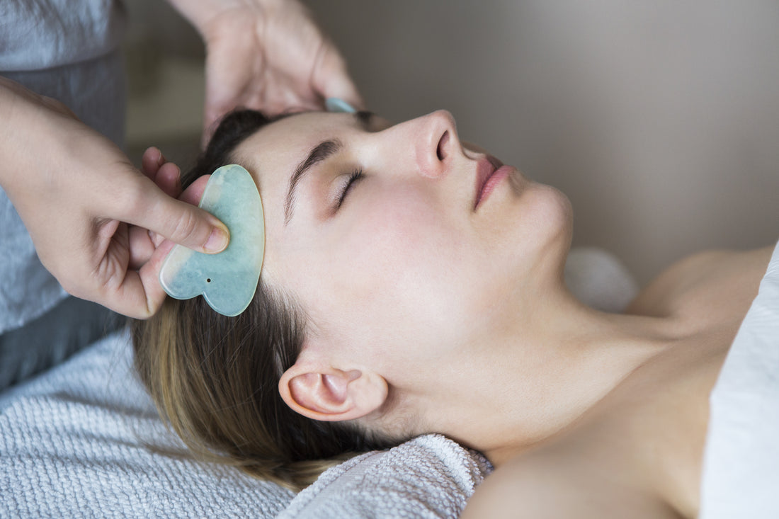 woman receiving gua sha therapy